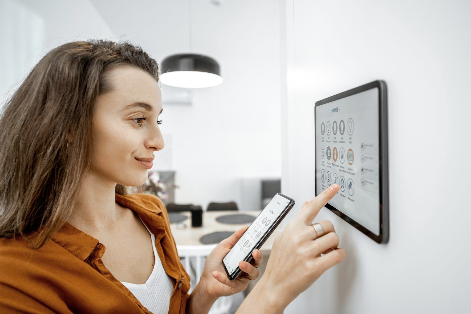 Homeowner controlling a smart home from a wall panel